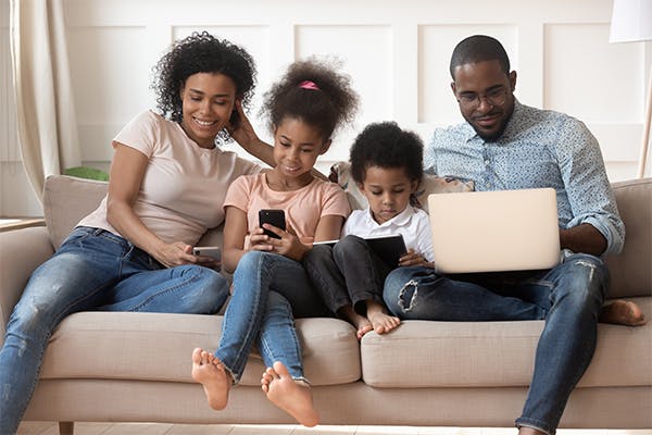 https://tower.10bestlifeinsurances.com/wp-content/uploads/2023/05/Happy-digital-tech-african-american-family-using-electronic-gadgets.jpg